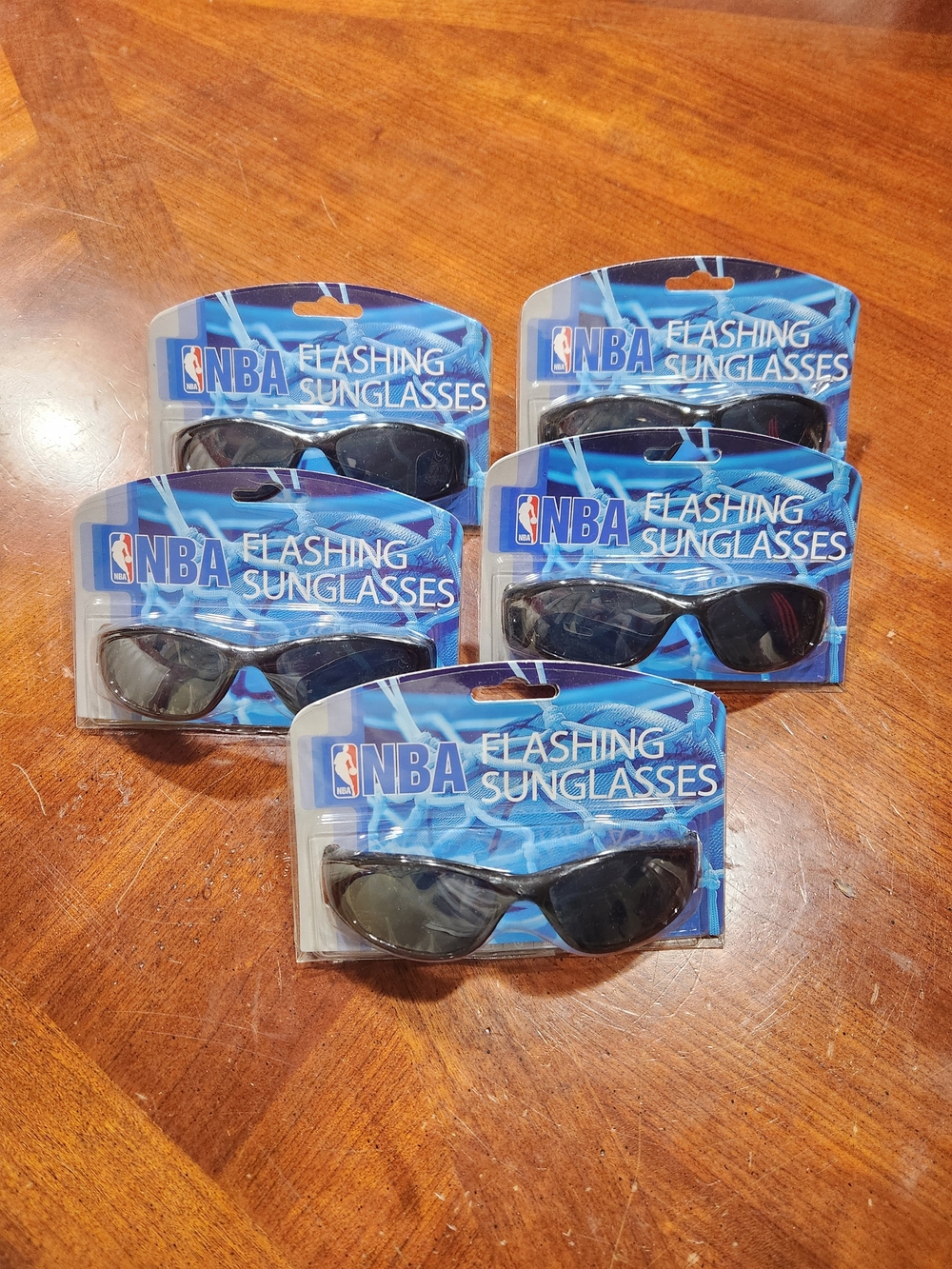 5 New NBA Los Angeles Lakers flashing sunglasses.